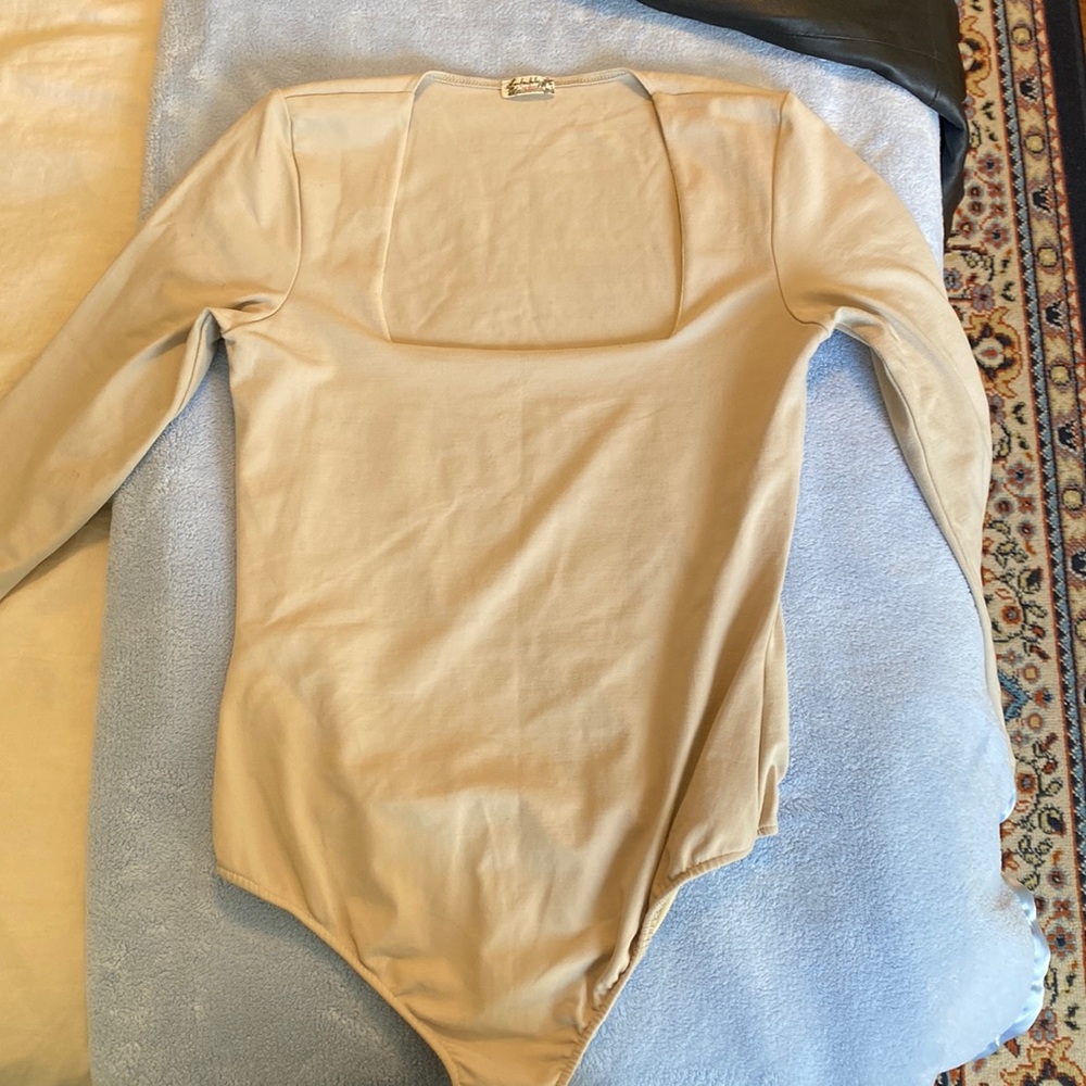 Free People cream bodysuit.